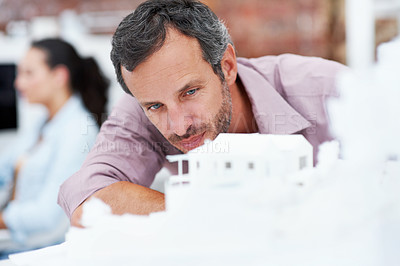 Buy stock photo Architecture, planning and man in office with model, building design and structure for inspection. Creative, business and person with 3d layout for blueprint, prototype and project for construction