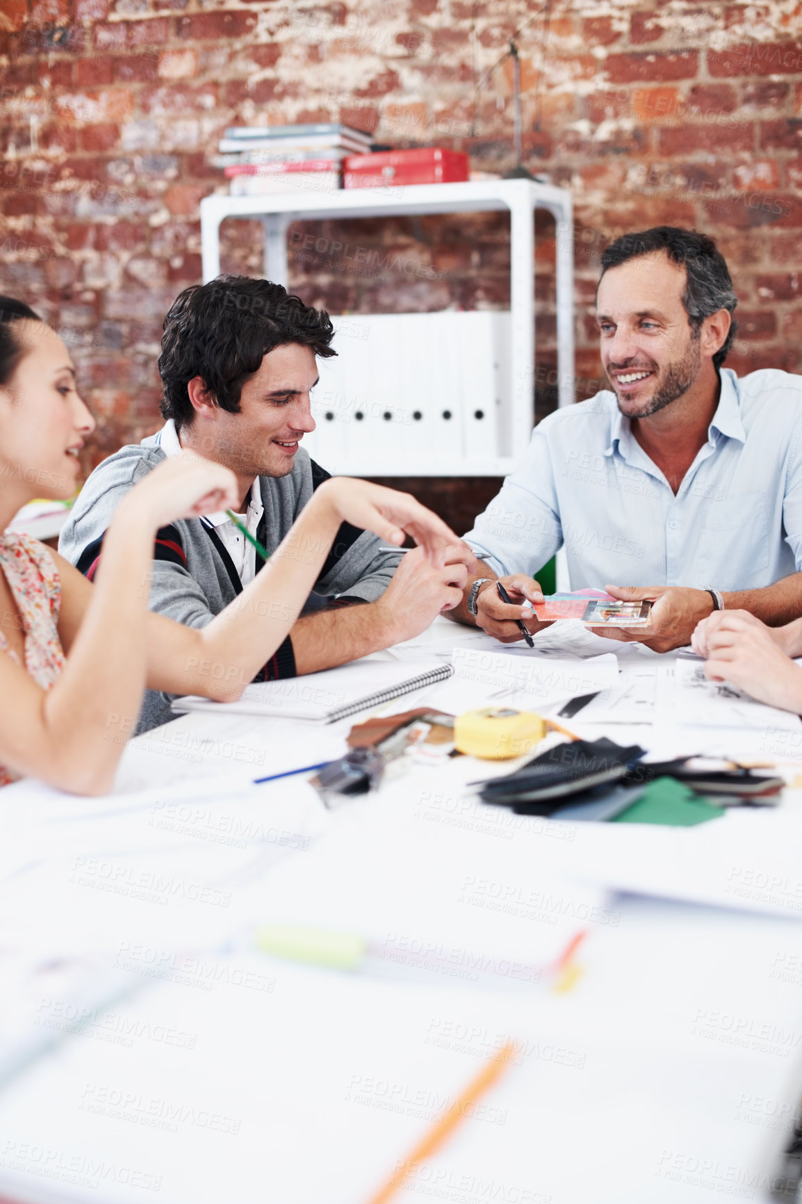 Buy stock photo People, team and conversation with swatch in office meeting for design, explain or review at media company. Employee, group and decision with document, feedback and collaboration at creative agency