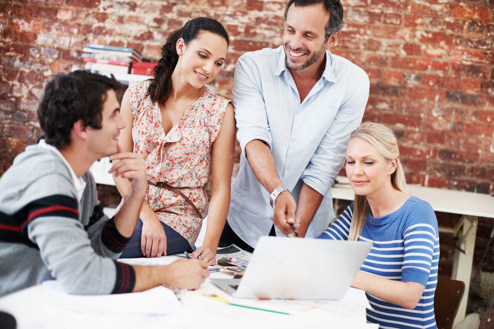 Buy stock photo Meeting, laptop and briefing with business people in office for mentor, design team and brainstorming. Creative crit session, manager feedback and online review with employees in startup agency