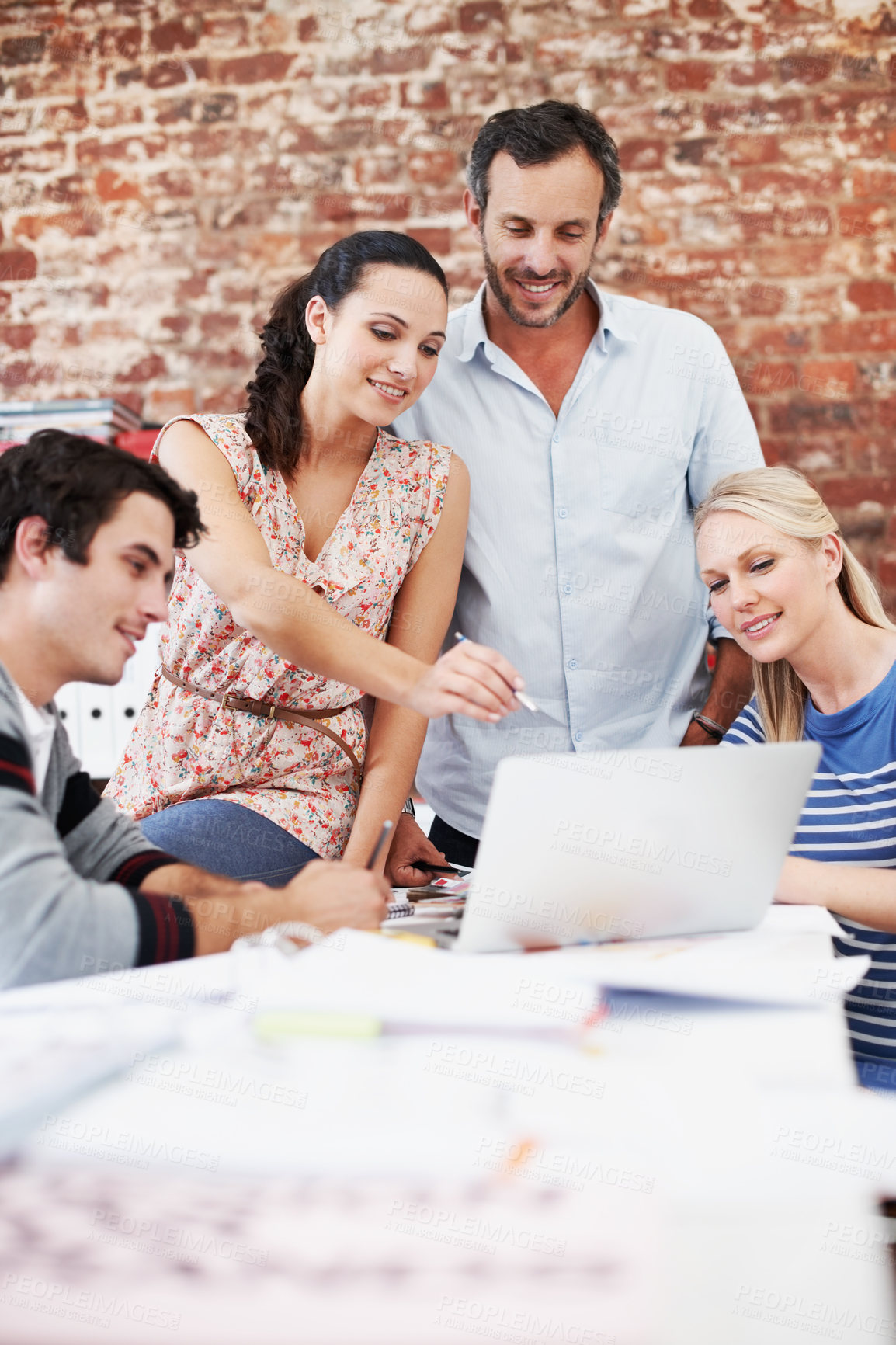 Buy stock photo Documents, team and laptop with business people in office for interior design, planning and blueprint review. Architect briefing, proposal feedback and brainstorming with employees in creative firm
