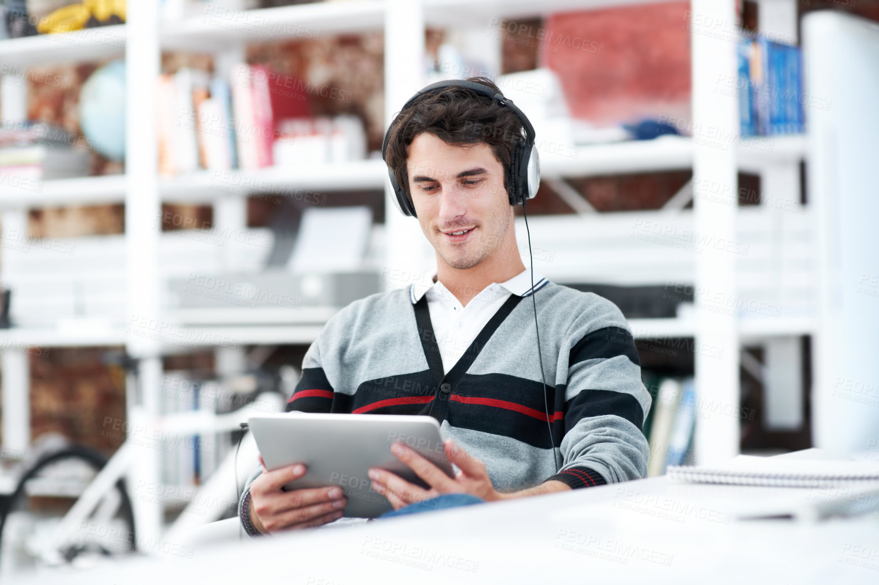 Buy stock photo Headphones, tablet and reading with business man in office for web developer, research and planning. Logo design, creative project and music with person in startup agency for branding update