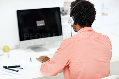 Buy stock photo Computer, headphones and back of business man in office for streaming, music and research. Audio subscription, professional and sound edit software with employee in media agency for project