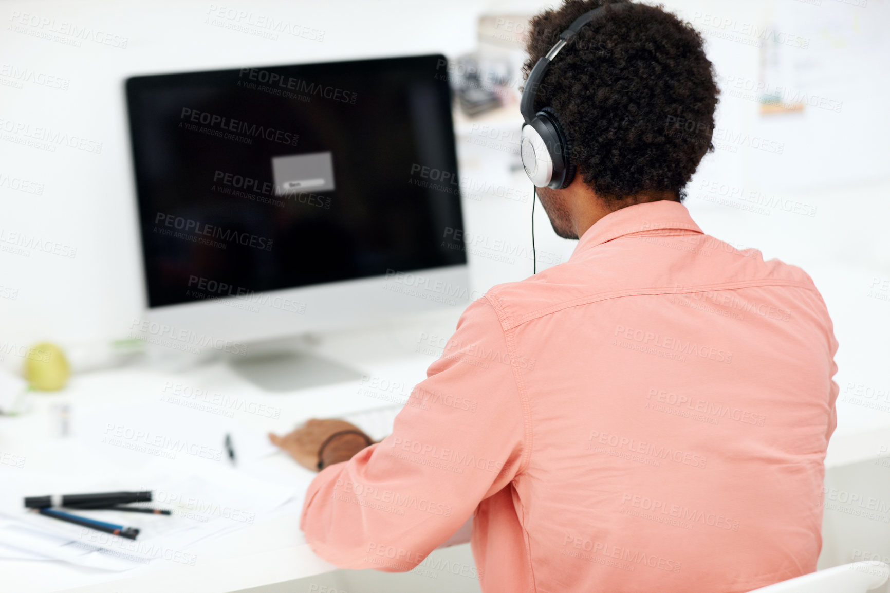 Buy stock photo Computer, headphones and back of business man in office for streaming, music and research. Audio subscription, professional and sound edit software with employee in media agency for project