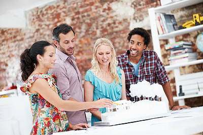 Buy stock photo Property development, review or team in office with model, collaboration or design project in meeting. Building, people or architects with prototype, site plan or group evaluation of structure layout