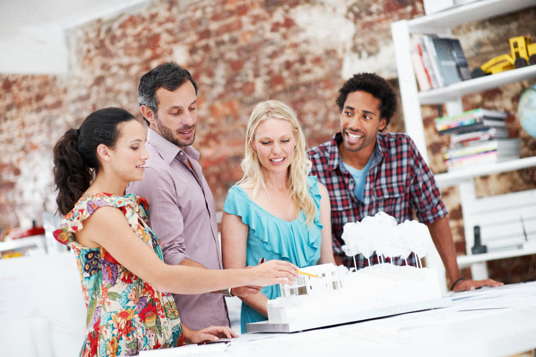 Buy stock photo Property development, review or team in office with model, collaboration or design project in meeting. Building, people or architects with prototype, site plan or group evaluation of structure layout