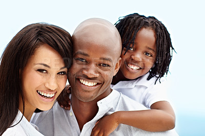 Buy stock photo Portrait of a smiling young family standing outside