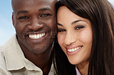 Buy stock photo Portrait of an affectionate couple enjoying a day outside together