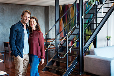 Buy stock photo Portrait of a smiling mature couple standing in their living room