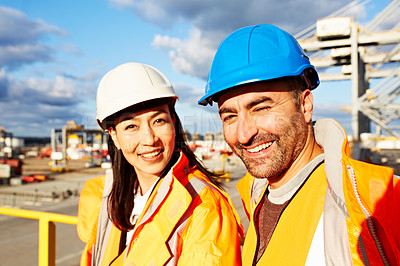 Buy stock photo Portrait of a two workers standing on a large commercial dock