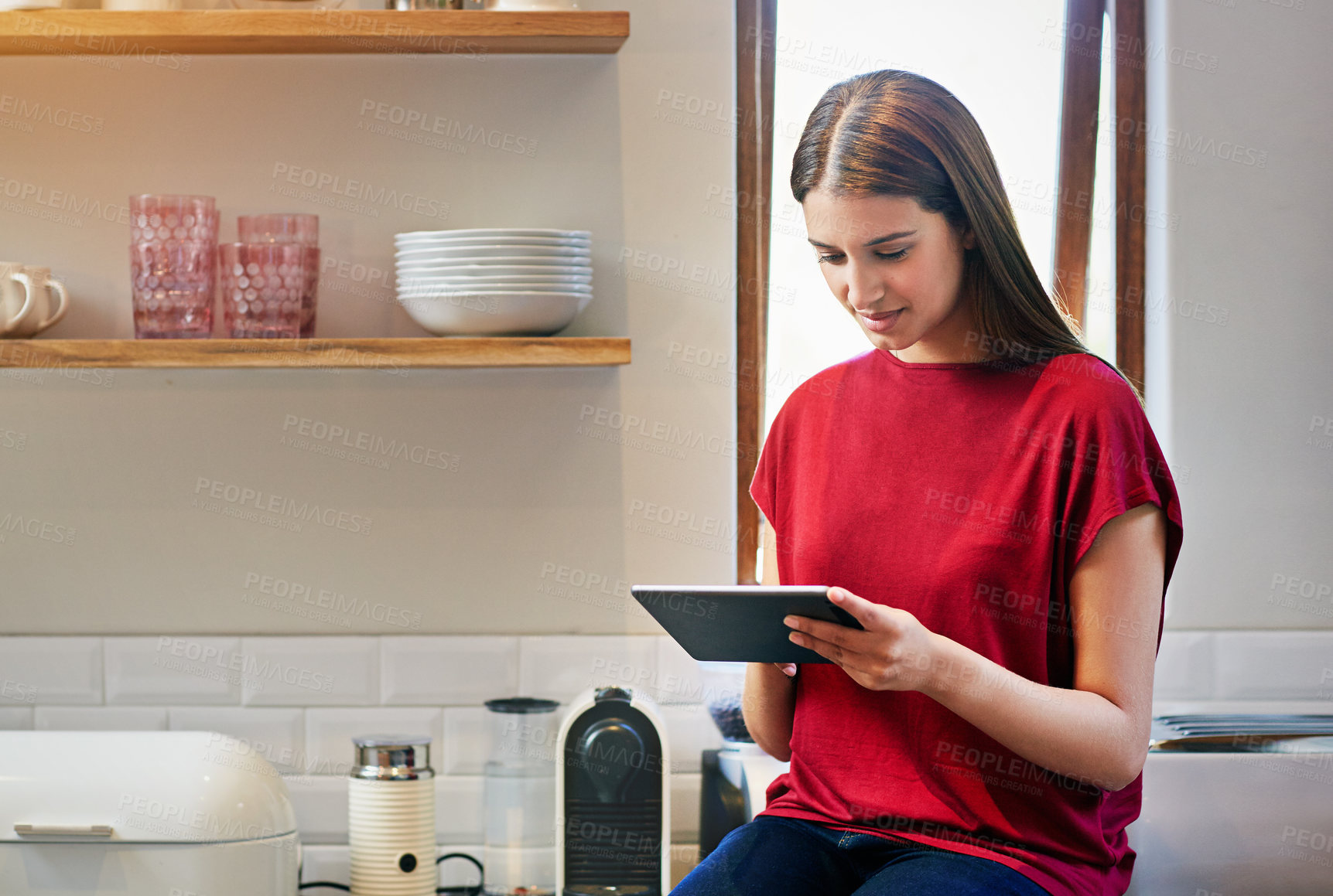 Buy stock photo Chill, woman and relax with tablet in home for online movie, binge watch series or ebook app. Me time, person and smile with tech in kitchen for streaming subscription, film and weekend entertainment
