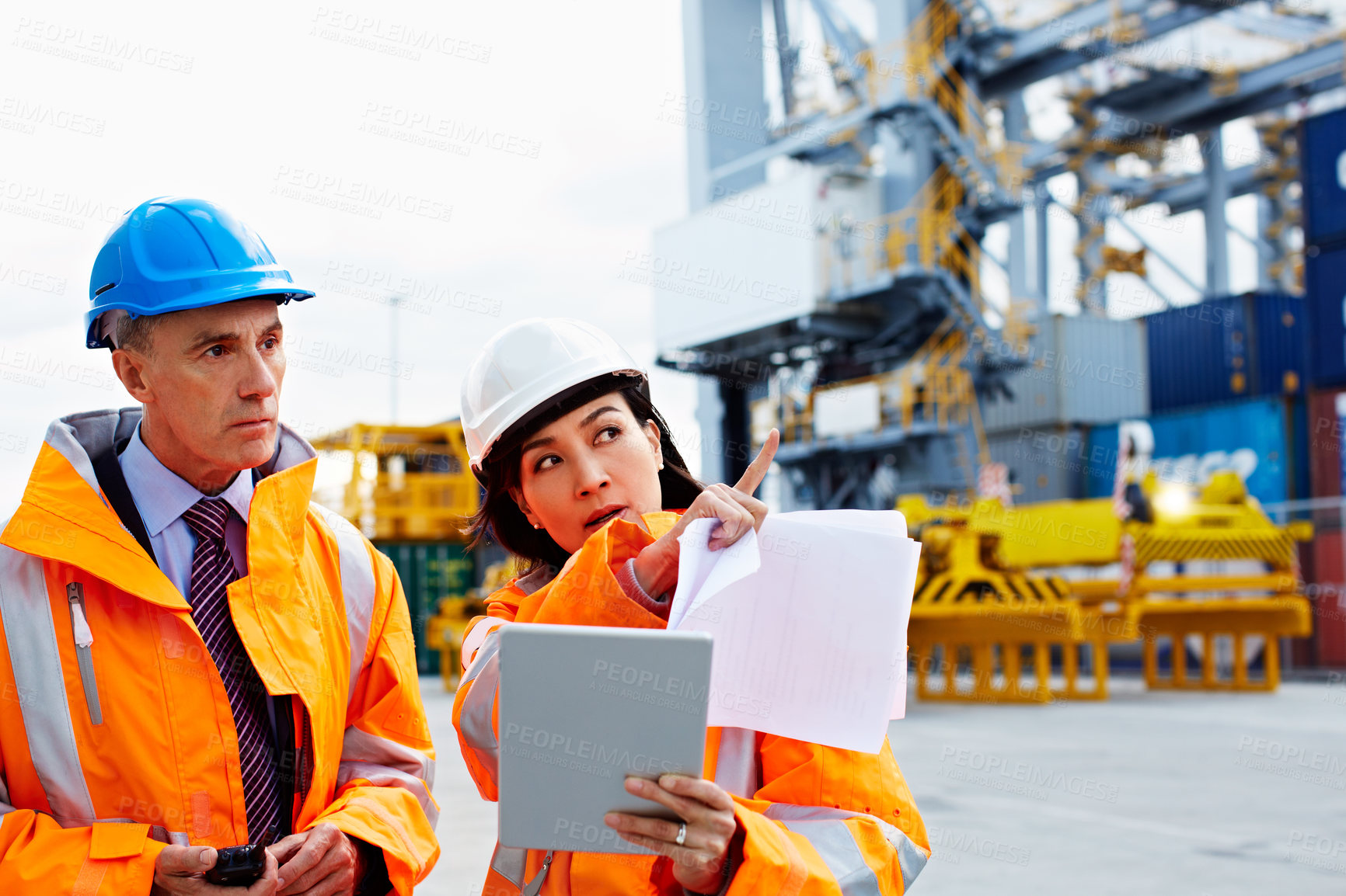 Buy stock photo People, talk and tablet by shipping container for logistics, freight operations and point to cargo. Supervisor, team and discussion outdoor in yard with tech, supply chain and gesture for export.