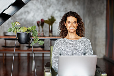 Buy stock photo Portrait of smiling woman sitting in her living room using a digital tablet