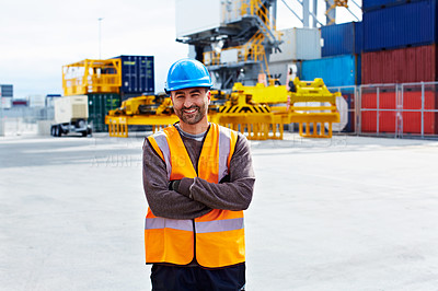 Buy stock photo Portrait of a young man in workwear standing outside on a large commercial dock