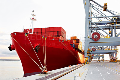 Buy stock photo Shot of a freighter waiting for cargo at a large commercial dock