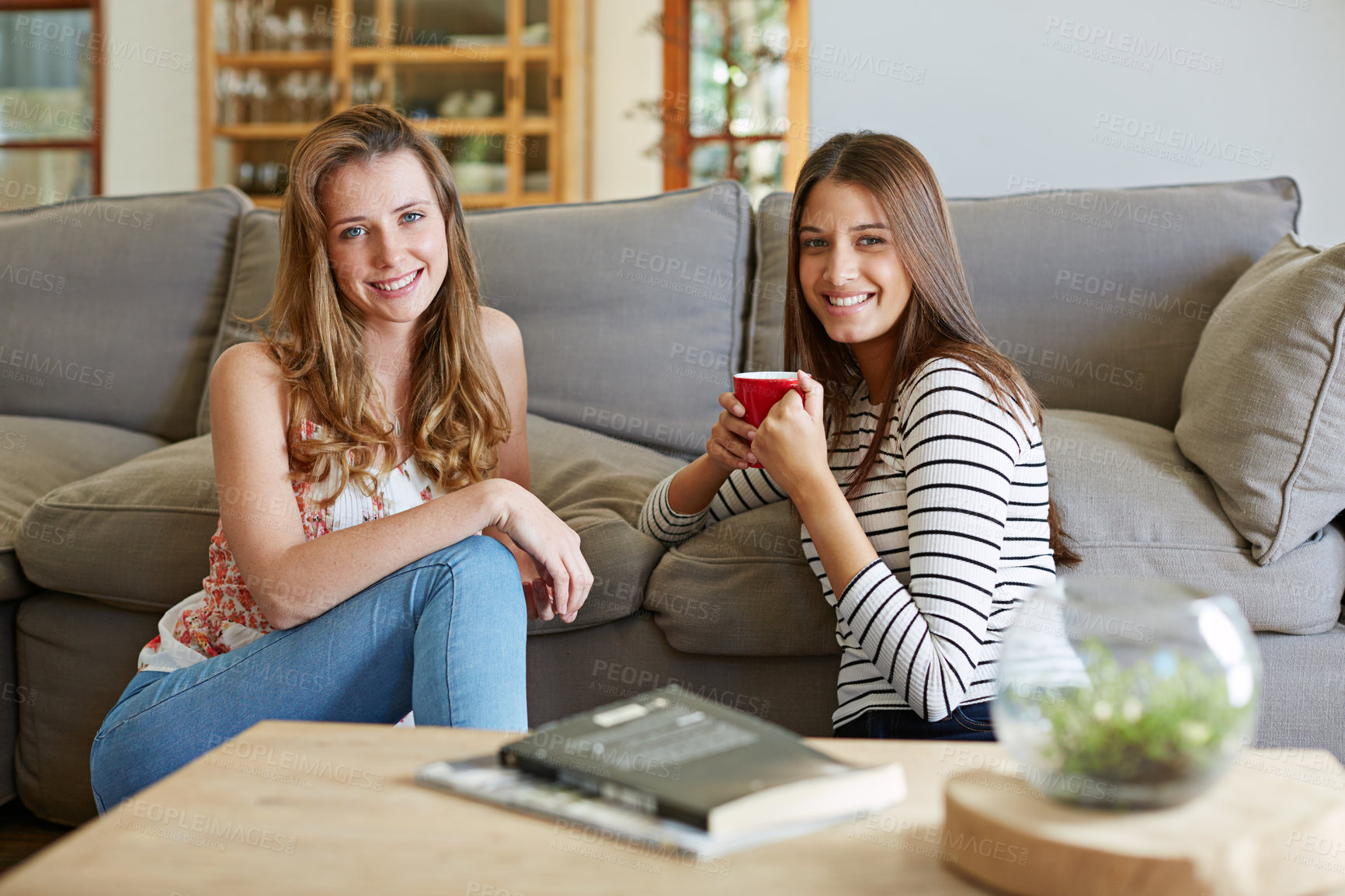 Buy stock photo Women, friends and portrait on floor with coffee, relax and happy with connection for bonding in home. People, smile and reunion with drink, story and gossip with secret in living room of apartment