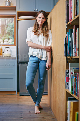Buy stock photo Portrait of a smiling young woman standing in a kitchen