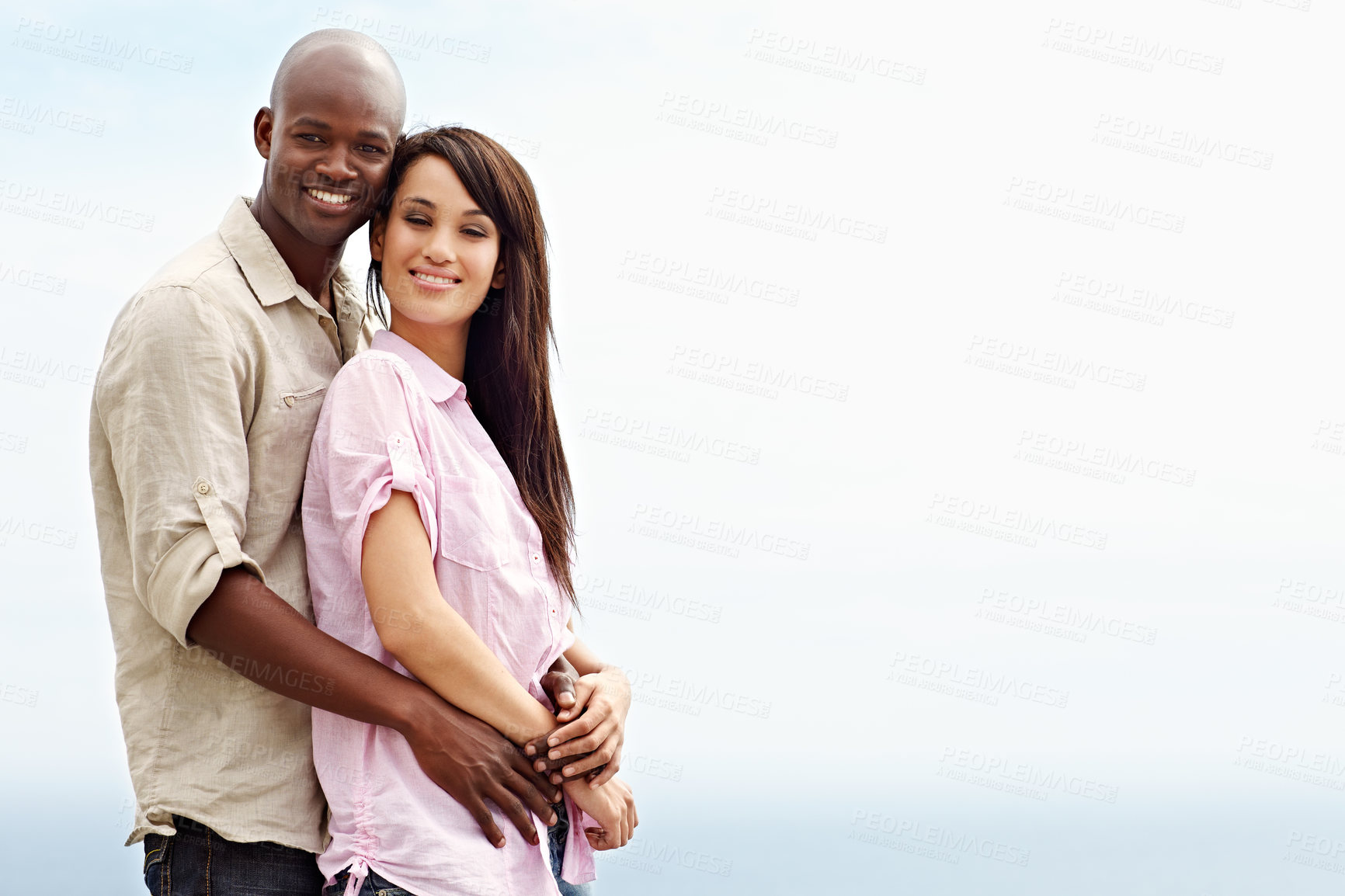 Buy stock photo Travel, portrait and hug with interracial couple outdoor for care honeymoon adventure or bonding. Connection, marriage commitment and support with man and woman for space, happy and date together