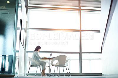 Buy stock photo Shot of a businesswoman working on her laptop in the office