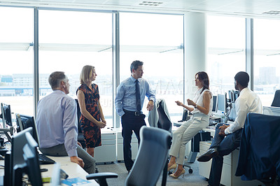 Buy stock photo Shot of a group of businesspeople talking in the office
