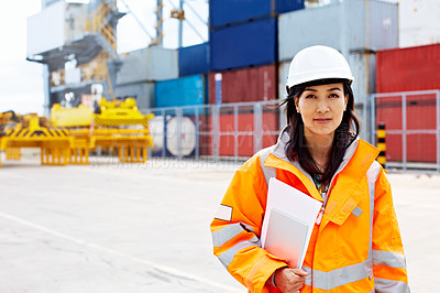 Buy stock photo Portrait of a woman in workwear standing on a commercial dock