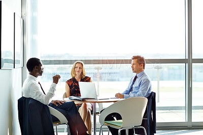 Buy stock photo Shot of a group of businesspeople having a meeting in an office