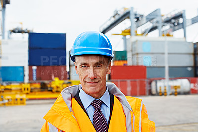 Buy stock photo Portrait of a mature man in workwear standing in a large commercial dock