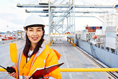 Buy stock photo Portrait of a woman in workwear standing on a commercial dock