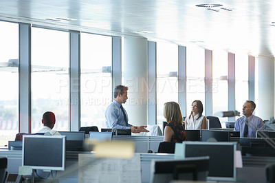 Buy stock photo Shot of a group of businesspeople talking in the office