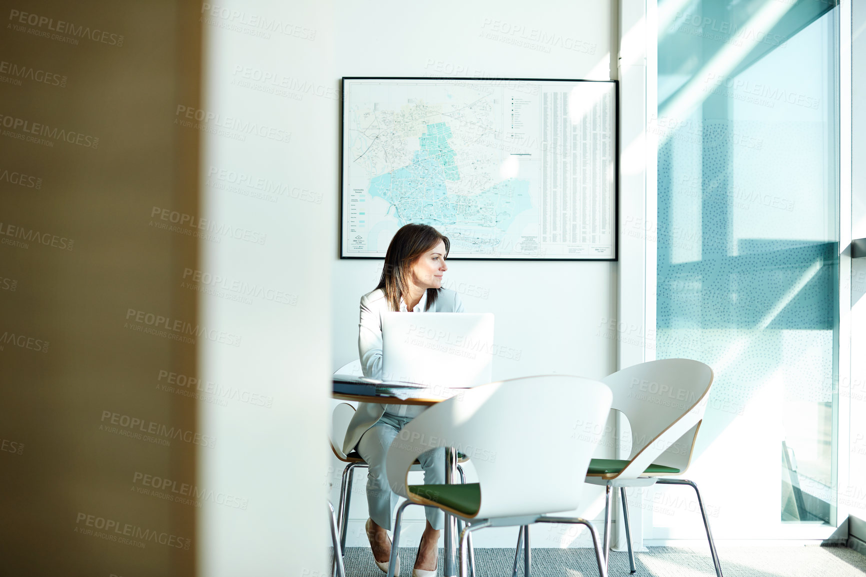 Buy stock photo Shot of a businesswoman working on her laptop in the office