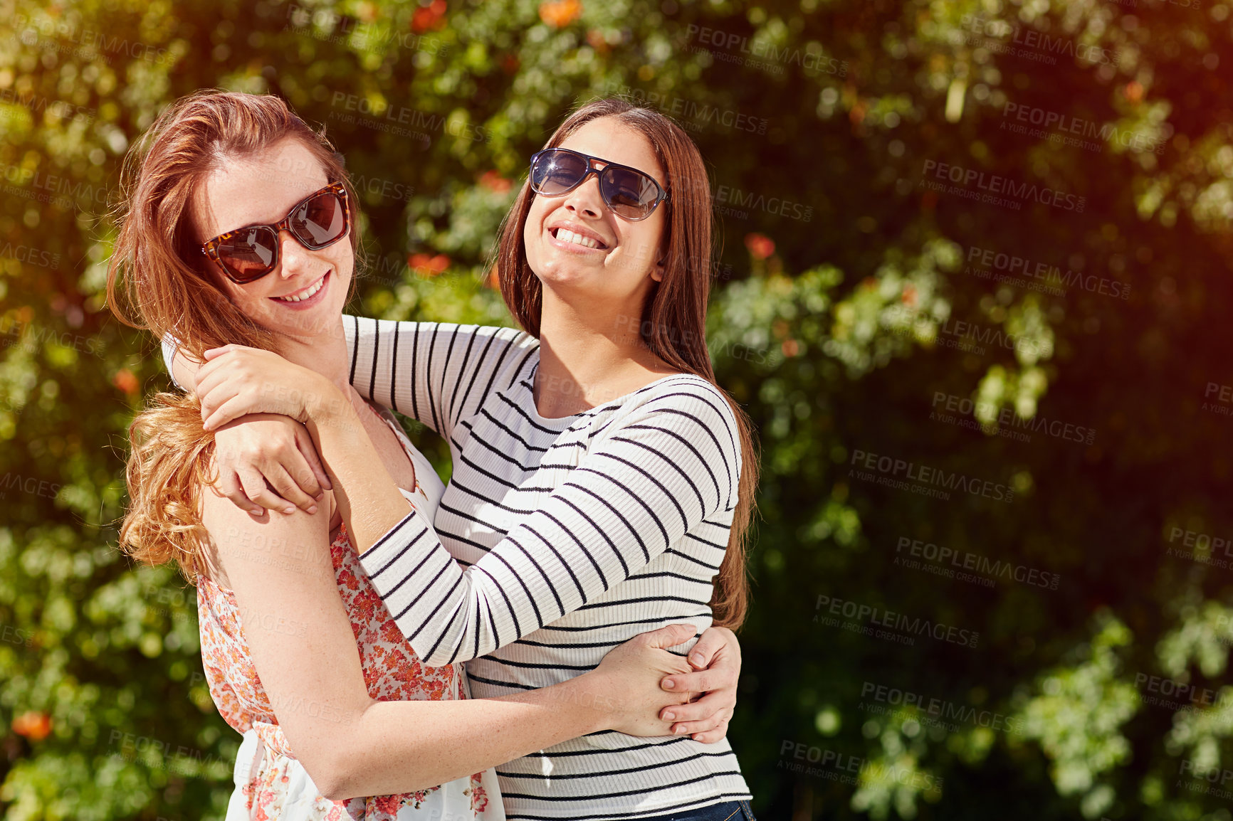 Buy stock photo Travel, sunglasses and hug with friends in nature for bonding, summer vacations and tourism. Support, connection and smile with women outdoor for reunion, weekend break and hangout space together