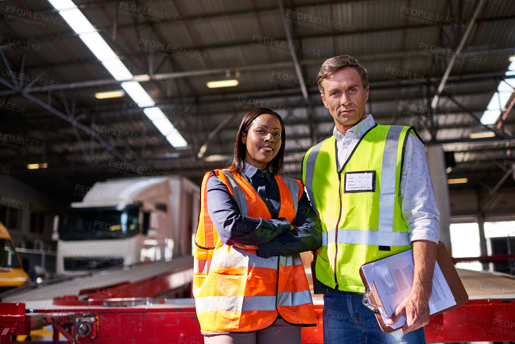 Buy stock photo Portrait of two workers standing in a large warehouse
