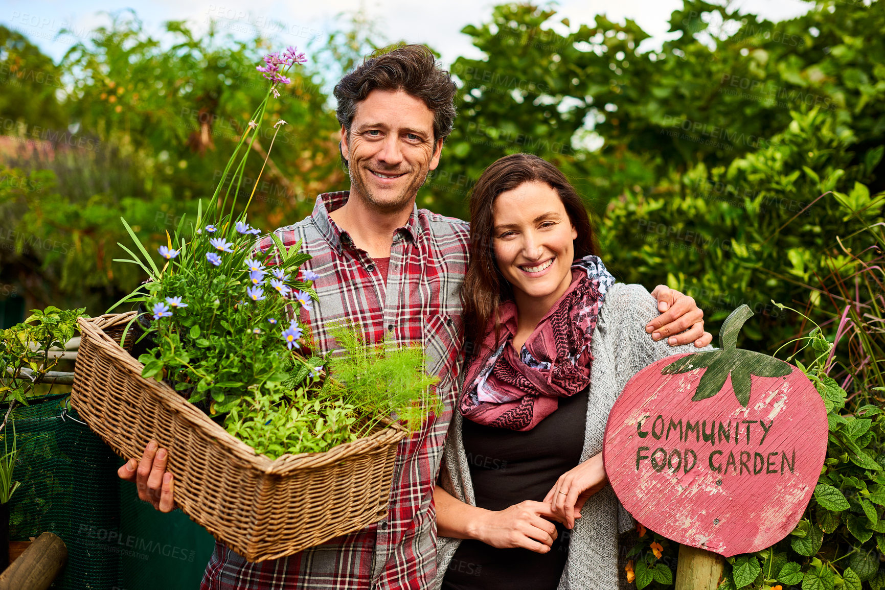 Buy stock photo Portrait of a smiling couple standing in their organic garden