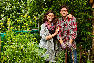 Buy stock photo Portrait of a smiling couple working in their organic garden