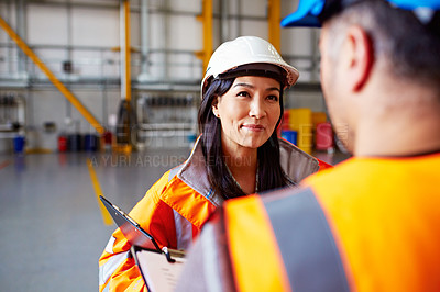 Buy stock photo Shot of two dock workers standing in a dockyard