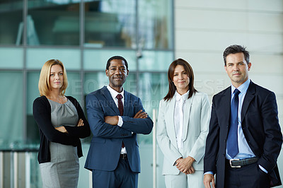 Buy stock photo Portrait of a group of businesspeople standing in the lobby of an office building