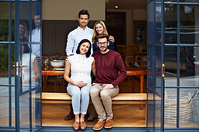 Buy stock photo Portrait of a group of friends sitting sitting on a dining room patio