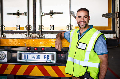 Buy stock photo Portrait of a smiling worker standing next a truck in a distribution warehouse