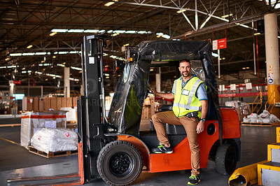 Buy stock photo Portrait of smiling forklift operator in a large warehouse