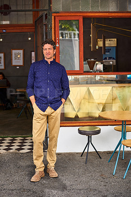 Buy stock photo Portrait of a man standing with his hands in his pockets in front of his cafe