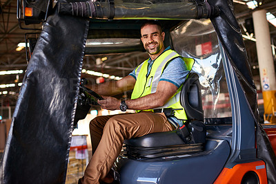Buy stock photo Portrait of smiling forklift operator in a large warehouse