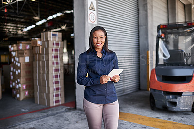 Buy stock photo Portrait of a warehouse manager holding a digital tablet while standing at the entrance to a warehouse