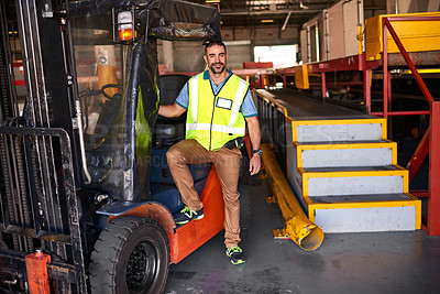 Buy stock photo Portrait of smiling forklift operator standing in a large warehouse