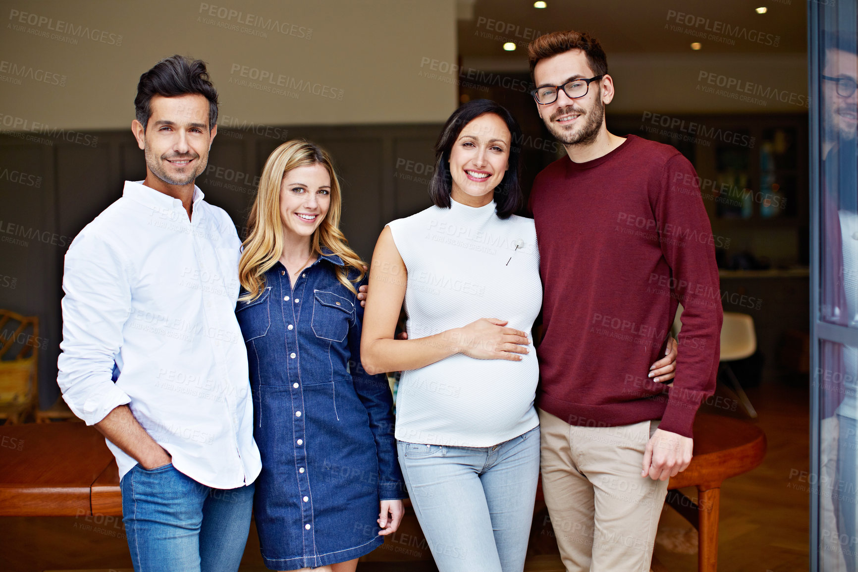 Buy stock photo Portrait of a group of young friends enjoying a get-together at home