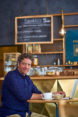 Buy stock photo Portrait of a smiling man working on a laptop in a cafe
