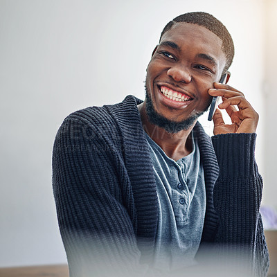 Buy stock photo Shot of a smiling young man standing against a gray background