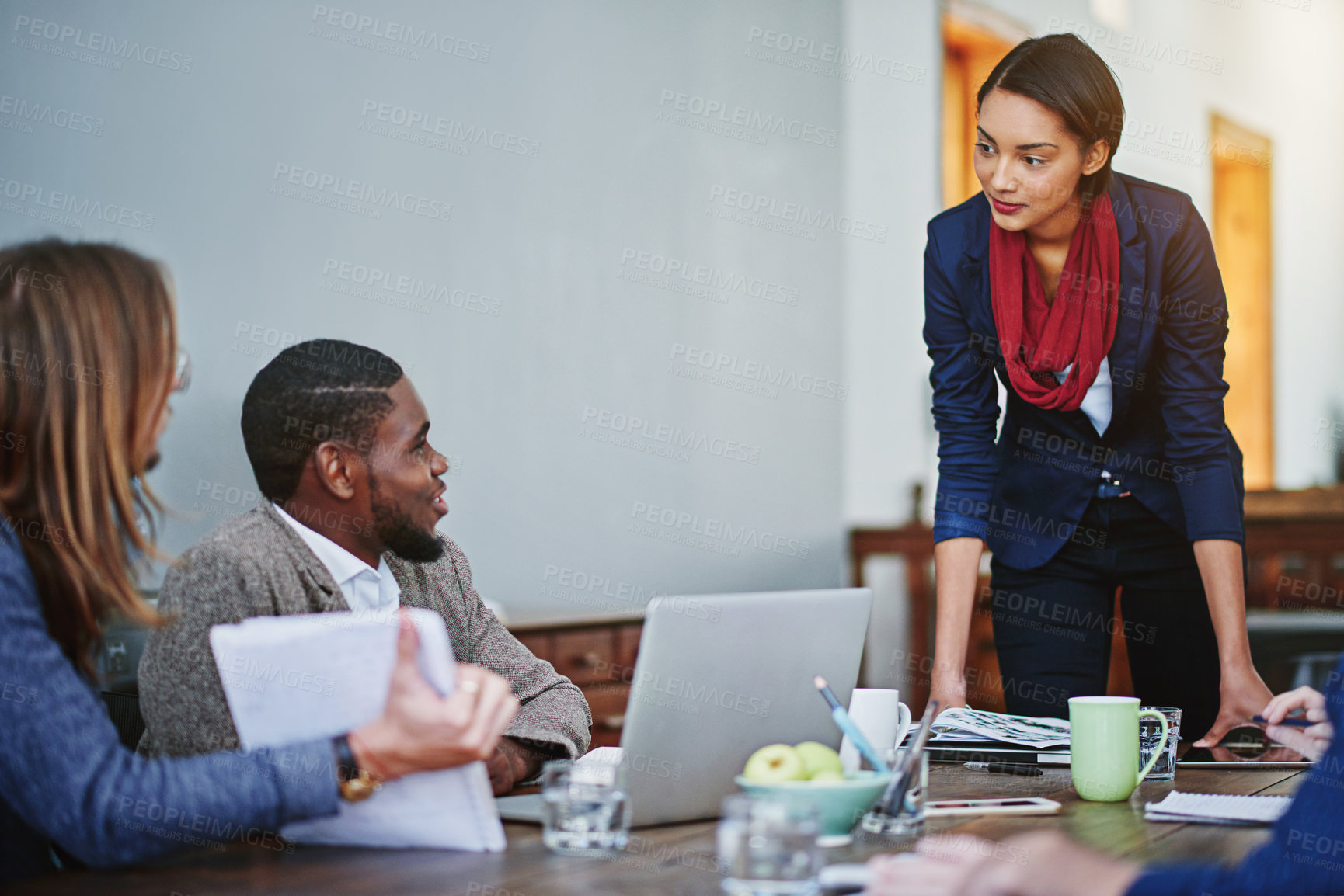Buy stock photo Creative team, meeting and woman with laptop, discussion or planning for delegation in office. Manager, review and report with tech for collaboration, brand consultant or campaign project in startup