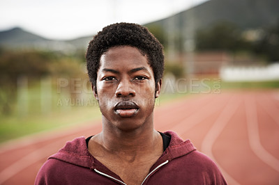 Buy stock photo Portrait of an athletic young man standing outside on the track