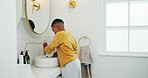 Boy, child and toothbrush in bathroom with tap water, dental health and morning routine for wellness. Kid, hygiene and basin in home for brushing teeth, getting ready and oral care for fresh breath.