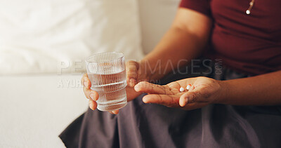 Buy stock photo Medical, water and hands in house with pills, symptoms management or prescription in health routine. Wellness, dose or woman with glass, treatment plan or illness recovery in pharmaceutical care.