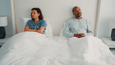 Buy stock photo Angry, couple and thinking in bedroom, ignore or woman with arms crossed after conflict in apartment. Mature African people, reflection and contemplating divorce in home, marriage crisis and fight